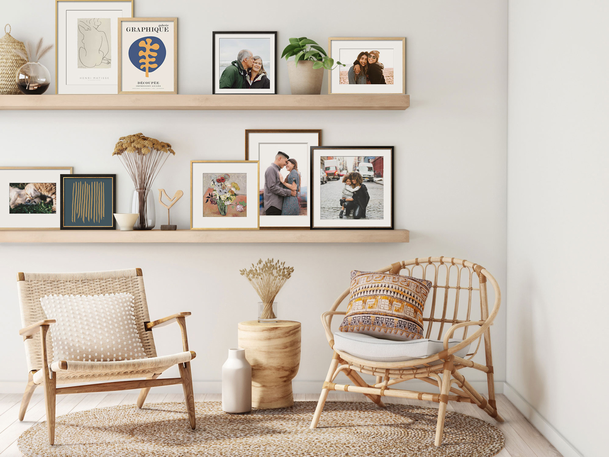 reading nook with two chairs and wall mounted shelves filled with decor and framed photos